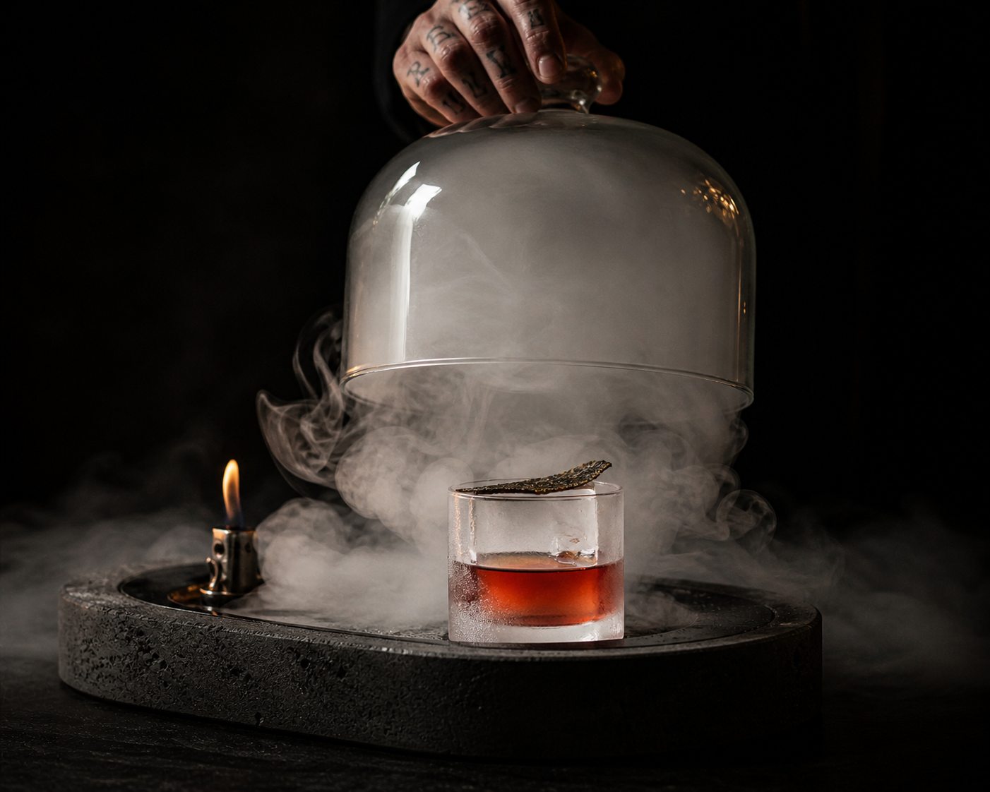 Cocktail under a smoking glass dome
