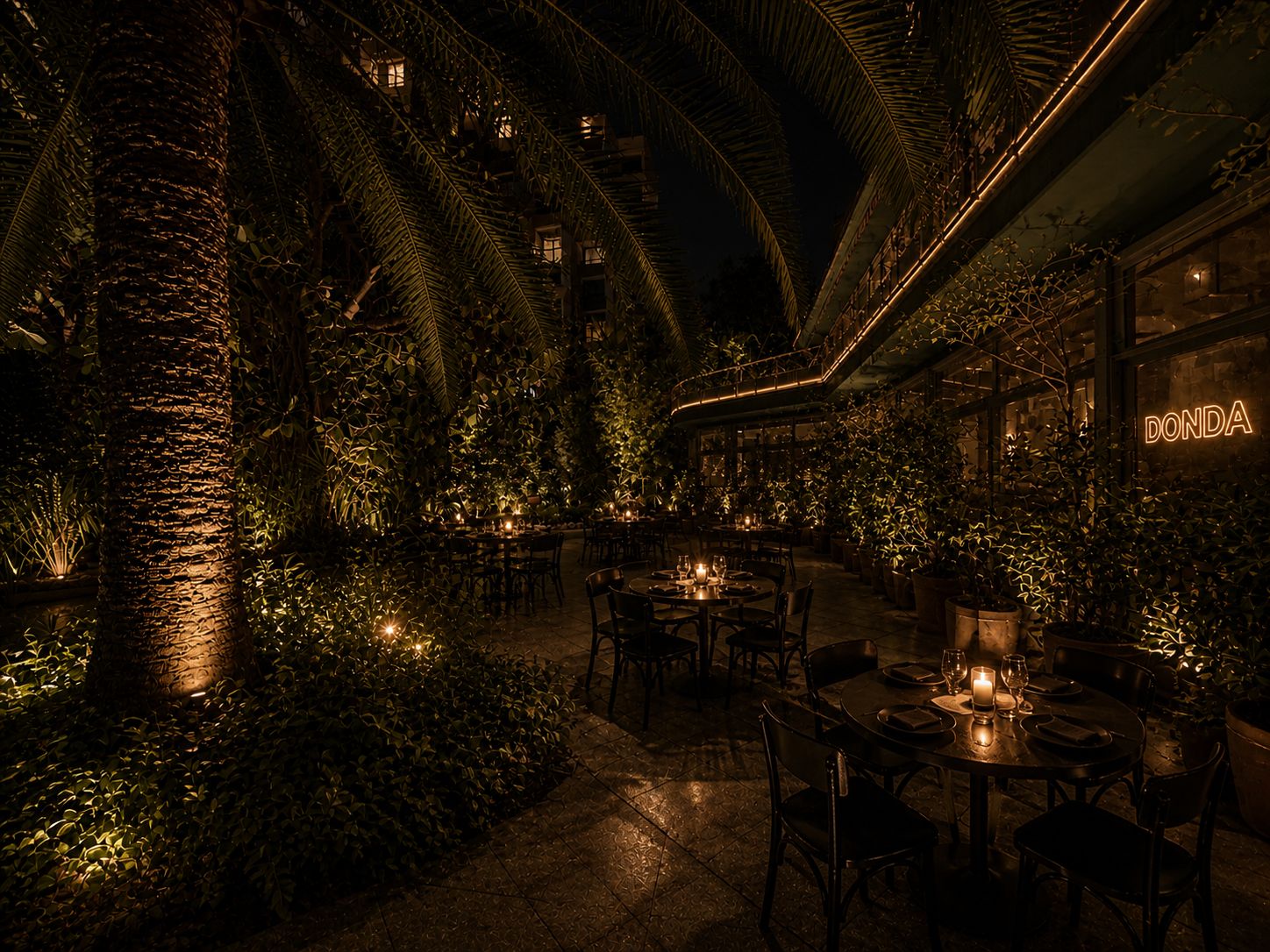 The Secret Garden at night: palms, candle-lit tables, DONDE neon glowing on the back wall